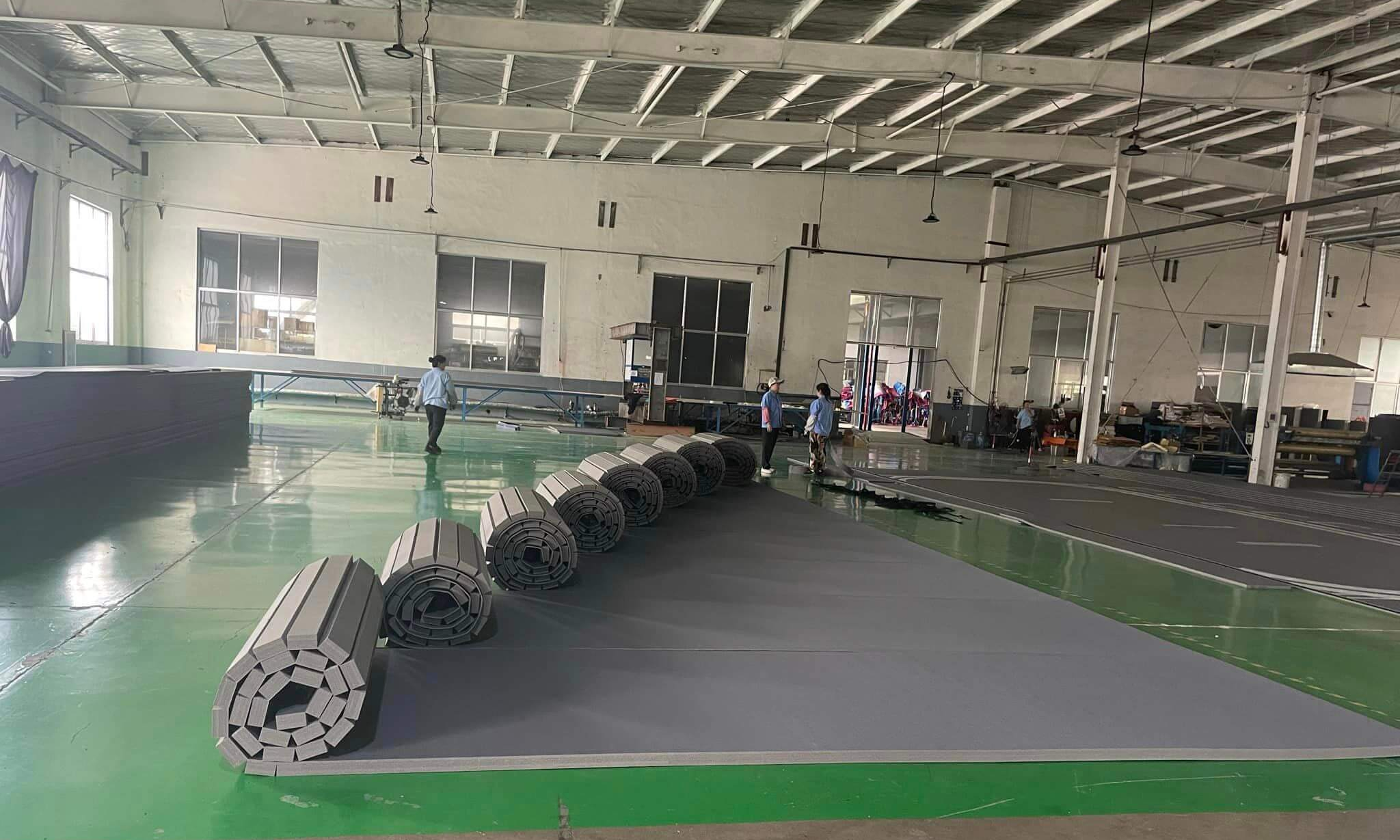 Why More Gyms Choose Roll Out Mats: A Factory Story Behind Martial Arts Flooring